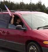 flag held out car window